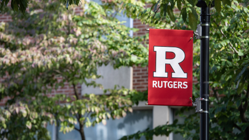 A scarlet red banner bearing the Rutgers University "block R"