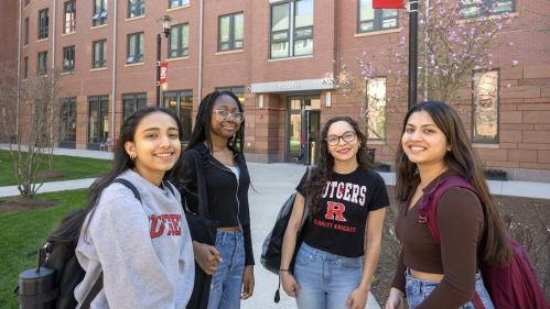 Akriti Sood (RBS '26), Izabellar Tulasi (SAS '27), Alejandra Afanador (SAS '27), and Mana Shah (SAS '26) chat outside in front of Honors College on the College Avenue campus