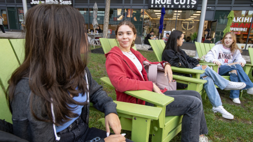 Bianca La Fata (SEBS ’25), Alexis Salamon (SAS ’24), and Patricia Ranone (SEBS ’26) enjoy a fall day sitting at The Yard on the College Avenue campus.