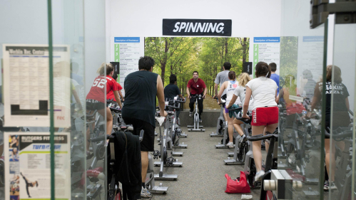 A spin class taking place at one of the rec centers