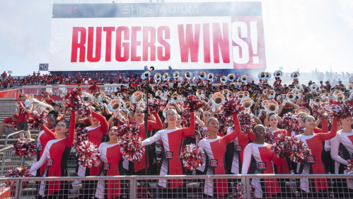 Rutgers marching band and cheer team performs at the conclusion of the winning football game against Northwestern.