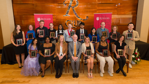 Students and professors from the School of Graduate Studies sitting down at an awards ceremony