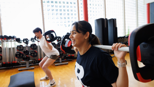 Students lifting weights