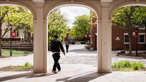 A student walking across campus