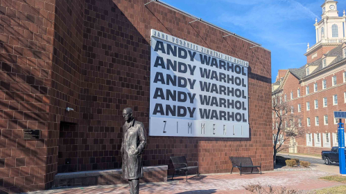 A banner hung outside the Zimmerli Art Museum touts the new Andy Warhol exhibition at Rutgers.