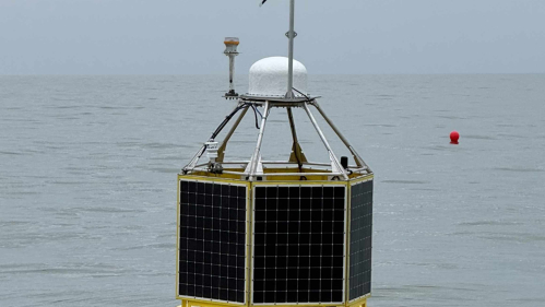 A Rutgers research buoy floats on the surface of the Atlantic Ocean.