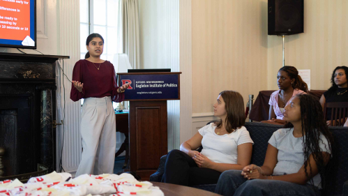 Rida Kadri (left) leads a training session for RU Voting ambassadors in Wood Lawn Mansion.