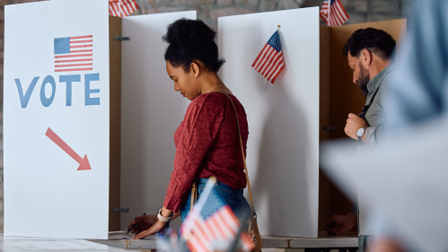 Woman voting at the polls.