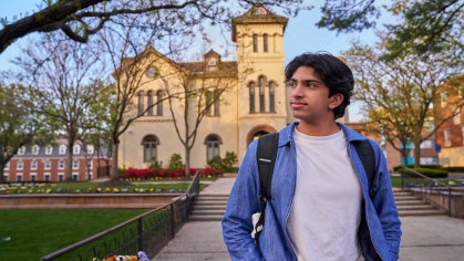 Aditya Patel walking in front of Bishop House