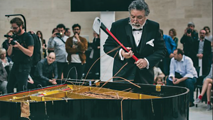 Raphael Montañez Ortiz at one of his many piano destruction concerts, at the Mudam museum in Luxembourg. Photo by Remi Villaggi.