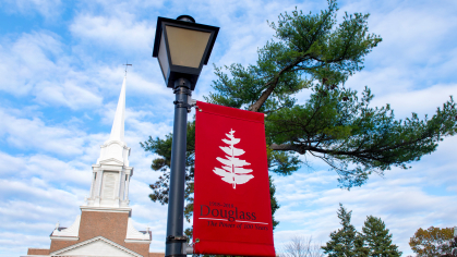 Douglass campus banner outside of the Voorhees Chapel