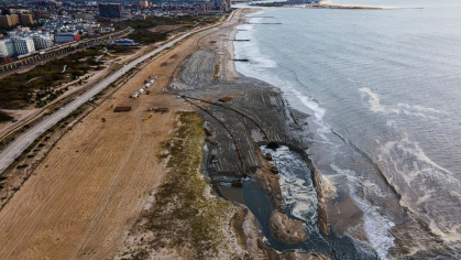 Contractors for the U.S. Army Corps of Engineers pump sand from the ocean floor onto the beach in the Rockaway Peninsula in New York City, Oct. 18, 2022.