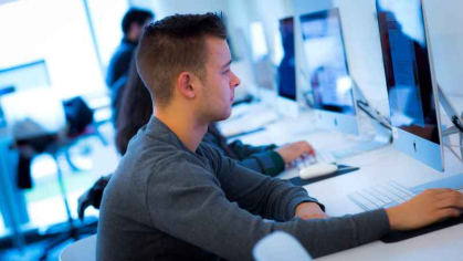 Student working at desktop computer