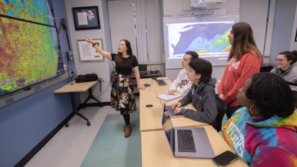 Department of Marine and Coastal Sciences associate professor Grace Saba leads a discussion with (l to r, front row ) undergraduate Brendan Henley (SEBS' 25), PhD candidate Lauren Cook (SEBS '25), PhD candidate Samantha Alaimo (SEBS '26), and graduate fellow Leah Hopson (SEBS '27) and (back row) lab researcher Julia Engdahl.