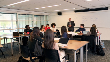 An instructor teaching a business class