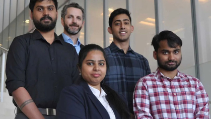 A group of five business professionals