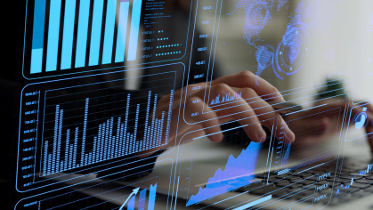 person typing on a computer with analytics on the screen 