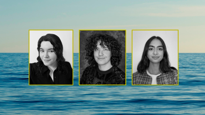 3 students with a backdrop of the ocean