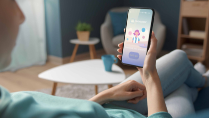 a woman holding a phone for online therapy