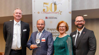 four people standing at the GSAPP 40th anniversary gala