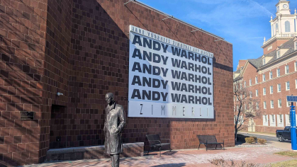 A banner hung outside the Zimmerli Art Museum touts the new Andy Warhol exhibition at Rutgers.