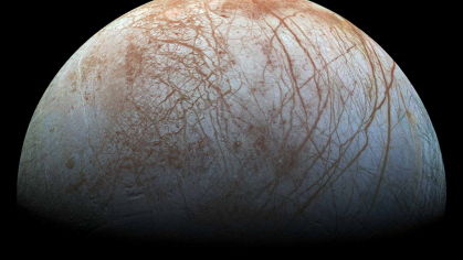 Europa, one of Jupiter's moon is white with brown stripes against a black background