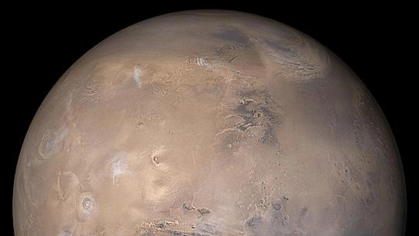 A three-quarters view of the planet Mars, set against the blackness of space.