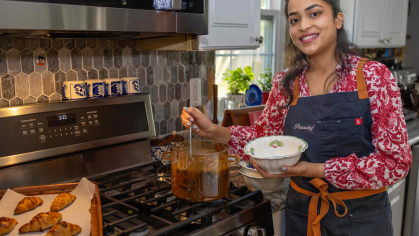 Rutgers senior Prachi Shashidhar serves up soup in her parents' kitchen.