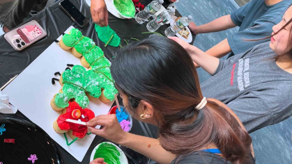 Students decorate cupcakes as part of a June contest in the Hatchery Innovation Studio within the Archibald S. Alexander Library.