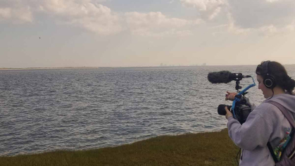 Rutgers alumni Kimberly Hansen films on location near the station in Tuckerton, N.J.