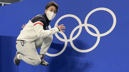 Sydney Chu jumping in the air