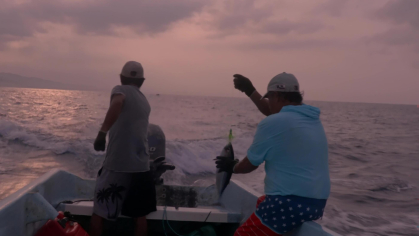 Two men in a motorboat fish off the Mexican coast in a scene from "Bajo el Sol (Under the Sun)."