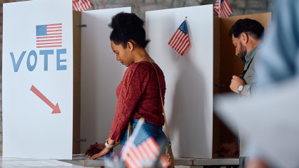 Woman voting at the polls.