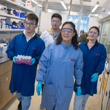 Chemistry graduate students Feng Xie and Guoyu Zhang, Distinguished Professor Jing Li, and graduate student Gia Carignan in the Jing Li lab in the Chemistry and Chemical Biology building