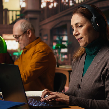 Adult learners working in a library