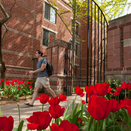 male student walking on Busch campus