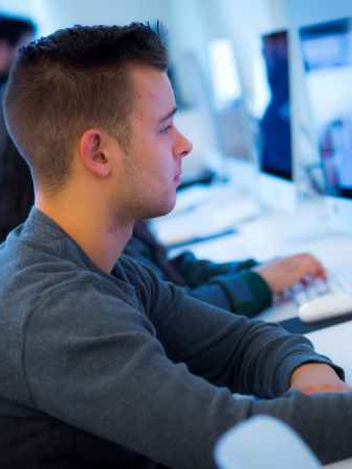 Student working at desktop computer