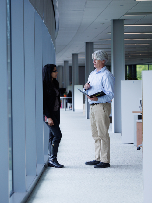 Two faculty discussing data.