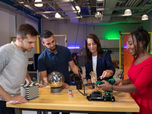 Professor Kristin Dana and three engineering students