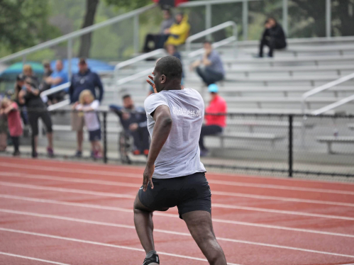 A blind student athlete runs on a track