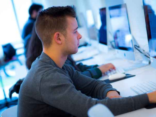 Student working at desktop computer