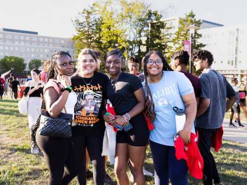A group of friends pose for a photo during Rutgers Carnivale