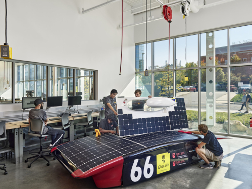 Students building a solar race car at the Rutgers student engineering studio