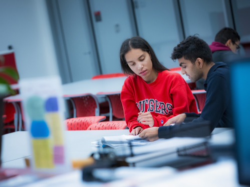 Karen Done (SAS '19) works with tutor Pratik Patel (SAS '18) in the learning center of the Rutgers Academic Building