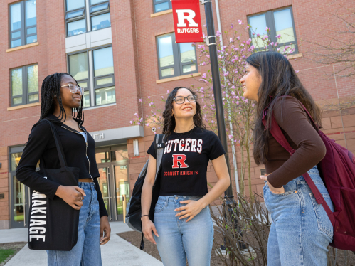 Three student speaking outside of the Honors College