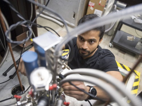 Postdoctoral student Mahapatra Phanibhusan Singha working with wires in an engineering lab