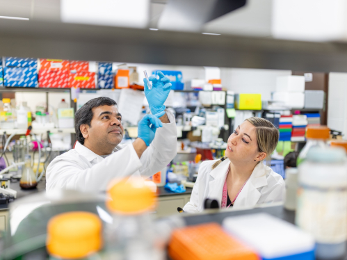 Rutgers Health postdoctoral research Satvik Mareedu in a lab
