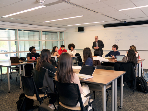 An instructor teaching a business class