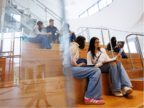 students studying on the stairs