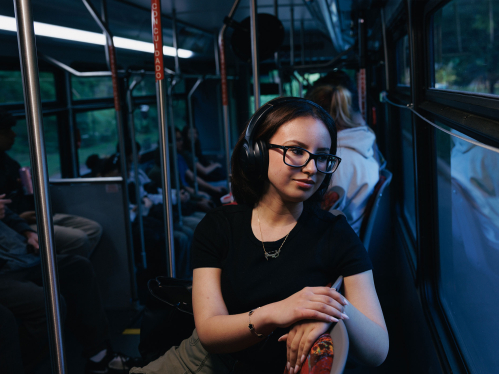 female student on a campus bus